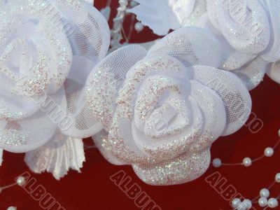 White wedding flowers against the red background