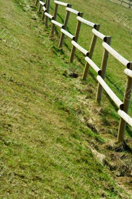 Wooden fence on the country field