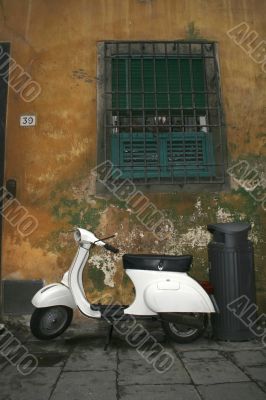 White old scooter on the road