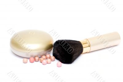 Set of cosmetics on white with balls
