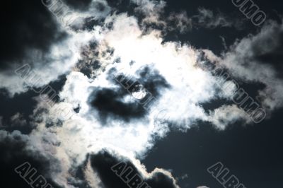 Moon and clouds on the dark sky