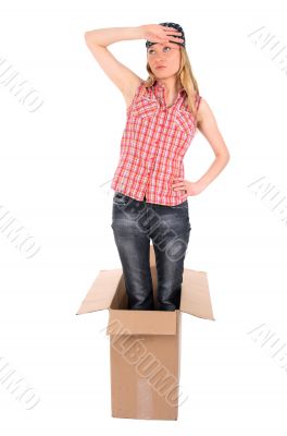 Tired girl standing in a cardboard box