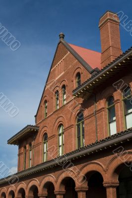 Building with pillars and chimney.