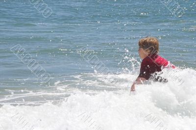 Boy Playing at the Ocean