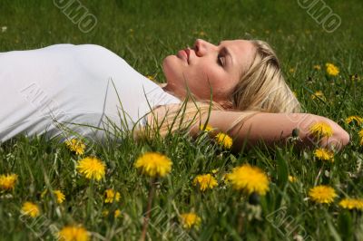 Woman lying on grass