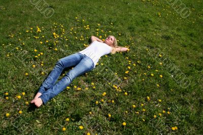 Woman lying on grass