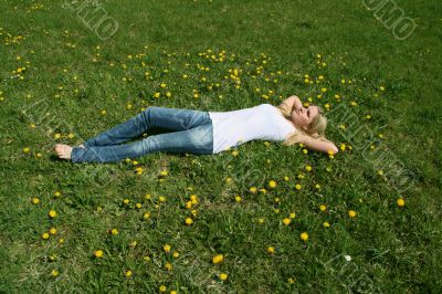 Woman lying on grass