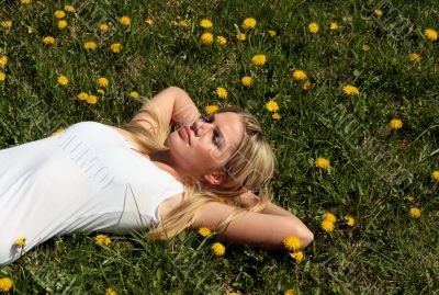 Woman lying on grass