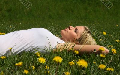 Woman lying on grass