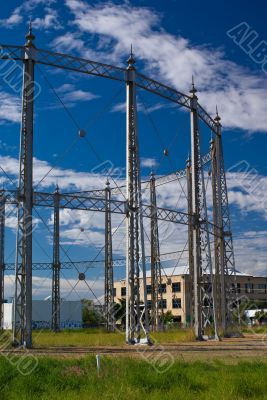 Gasometer against a Blue Cloudy Sky