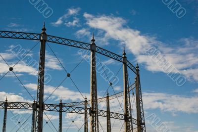 Gasometer against a Blue Cloudy Sky