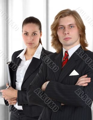 business couple before window