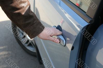 man is open the door of new car