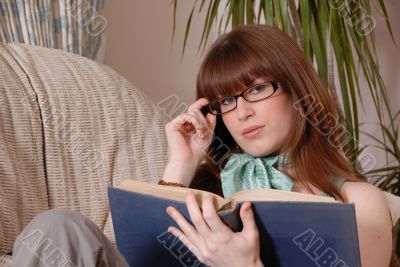 Cute girl reading book