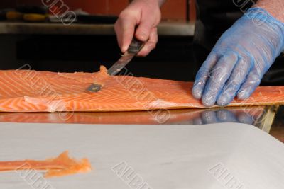 cutting smoked salmon close detail