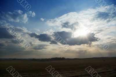 evening landscape with ray calling at sun