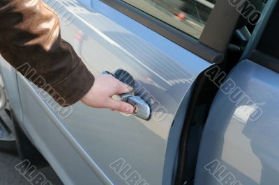 man is open the door of new car