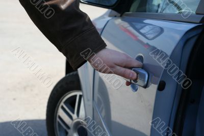 man is open the door of new car