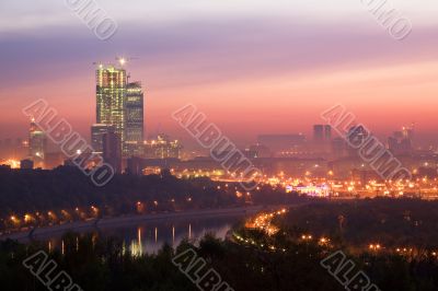 Sunrise, river, unfinished high-rise building