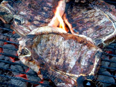 Grilled T-Bone Steaks Still Cooking