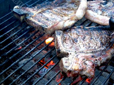 Grilled T-Bone Steaks Still Cooking