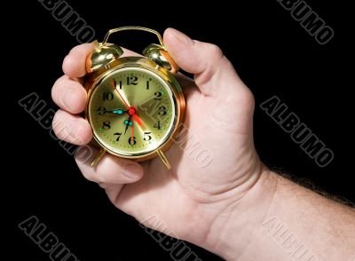 Alarm clock in a hand