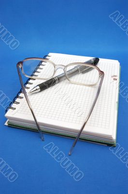 reading glasses and notebook