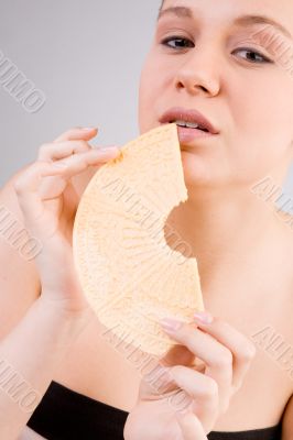 Young girl with bisquit