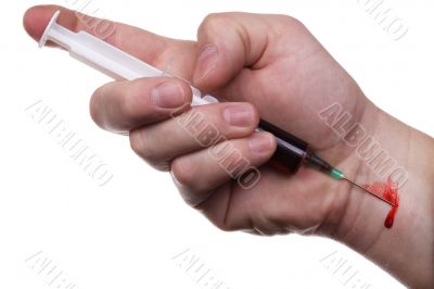 Hand, syringe, blood