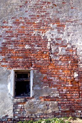 Red brick wall with close window