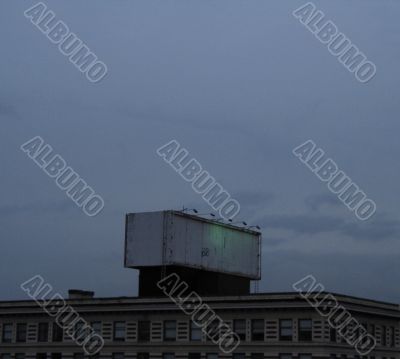 empty billboard on a building at dusk