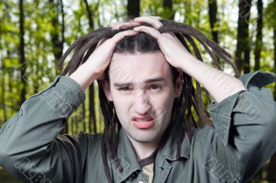 Young man with dreadlock hair.