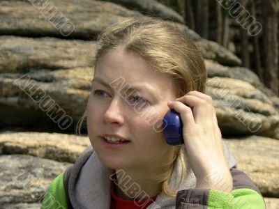 nice blonde speaks on a portable radio set