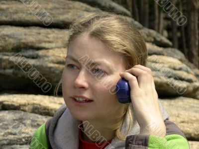 nice blonde speaks on a portable radio set