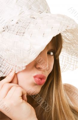 An attractive young woman in white bonnet.