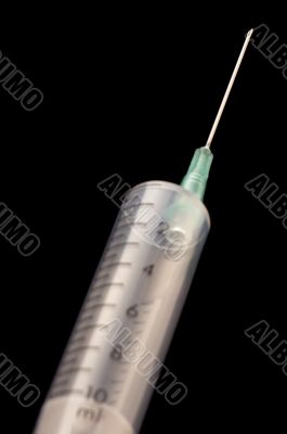 Syringe needle on black