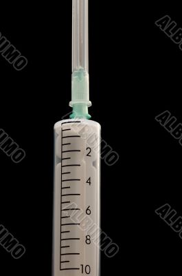 Syringe on black