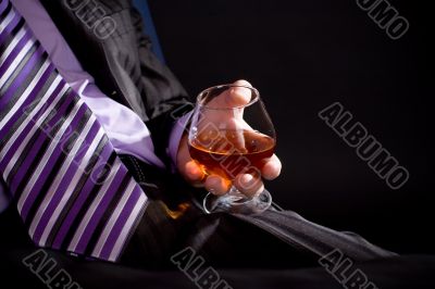 Relaxing man with cognac
