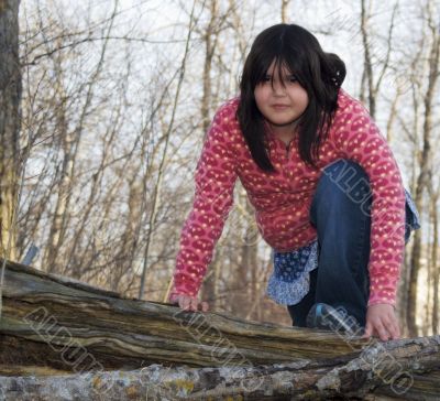 Girl Climbing A Tree
