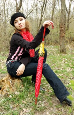 In forest with umbrella