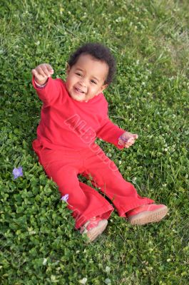 Baby playing on the grass