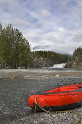 Red kayaks wait for tourists.