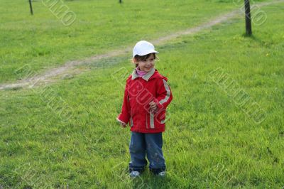 little girl is walking in the park