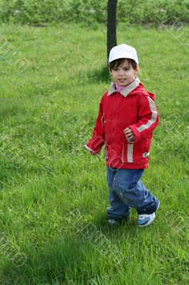 little girl is walking in the park
