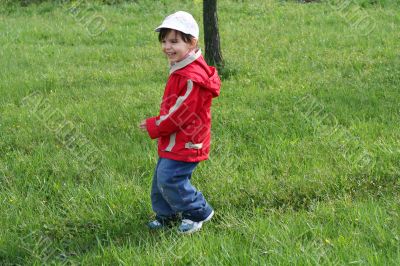 little girl is walking in the park