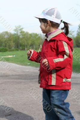 little girl is walking in the park