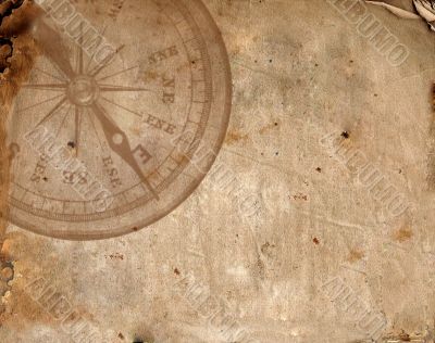 Compass on the old paper
