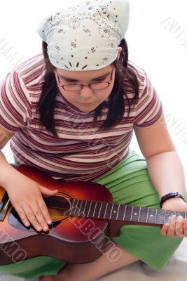 Child With Acoustic Guitar