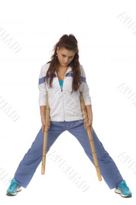 athletic woman with sticks
