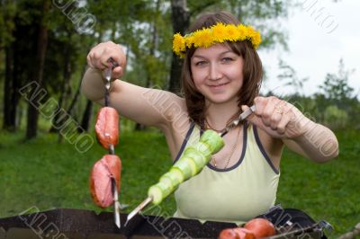 Woman cooking on brazier